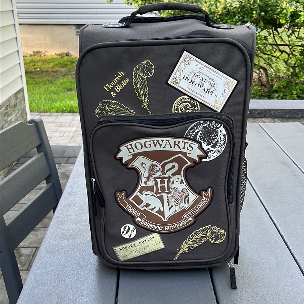 Target Black Rolling Luggage with Hogwarts Emblem
